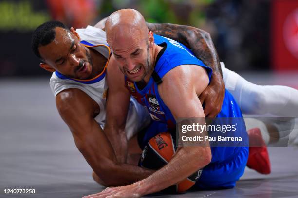 Nick Calathes, #99 of FC Barcelona and Adam Hanga, #8 of Real Madrid compete for a ball during the 2022 Turkish Airlines EuroLeague Final Four...