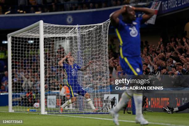 Chelsea's US midfielder Christian Pulisic and Chelsea's Belgian striker Romelu Lukaku react to a missed chance during the English Premier League...