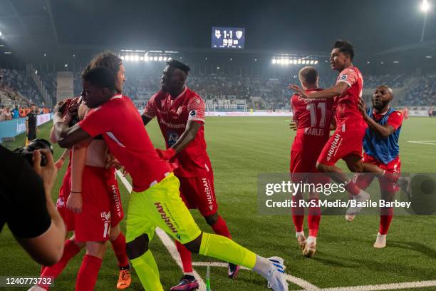 Sion players celebrate the winning goal in front of fans during the Super League match between FC Lausanne-Sport and FC Sion at Stade de la Tuiliere...