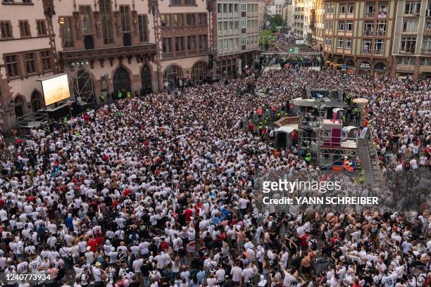 Eintracht Frankfurt fans gather at the Roemer Square in front of the town hall in the city centre of Frankfurt am Main, western Germany, on May 19...