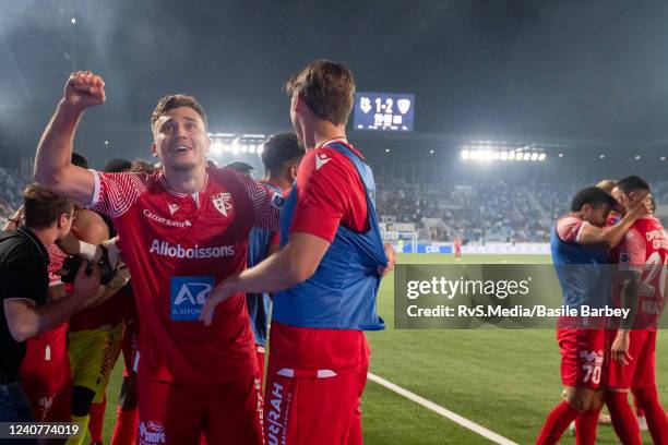 Sion players celebrate the winning goal in front of fans during the Super League match between FC Lausanne-Sport and FC Sion at Stade de la Tuiliere...