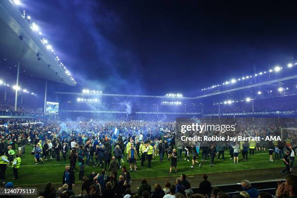 Fans of Everton celebrate with a pitch invasion as they avoid relegation during the Premier League match between Everton and Crystal Palace at...