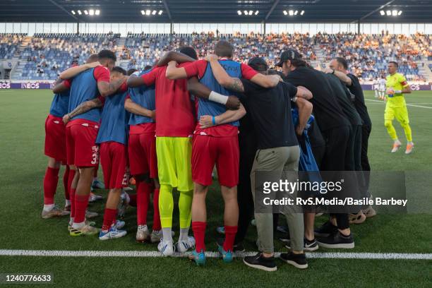 Sion players and staff gather before the Super League match between FC Lausanne-Sport and FC Sion at Stade de la Tuiliere on May 19, 2022 in...