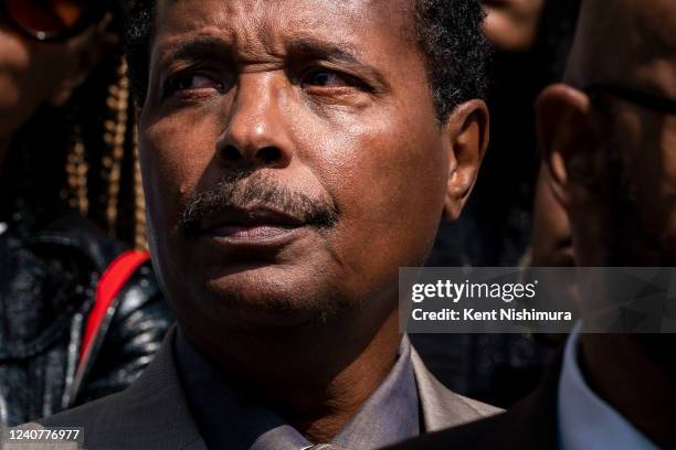 Tear runs down the face of Raymond Whitfield, the son of the late Ruth Whitfield, during a news conference with Rev. Al Sharpton and Attorney Ben...