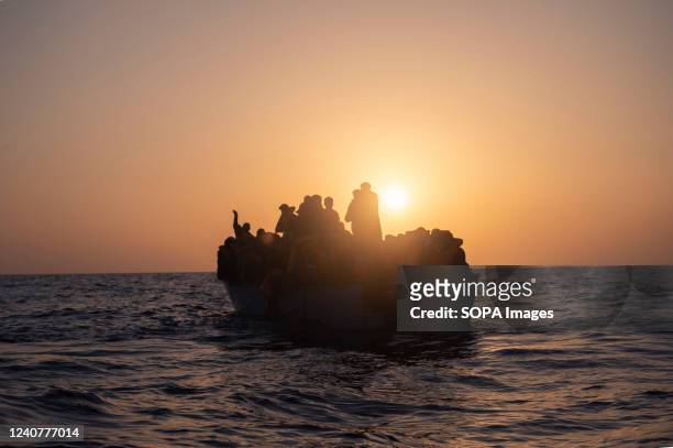 Group of migrants seen on a wooden boat in SAR Zone. The crew of Astral sailboat, of the Spanish NGO Open Arms, carried out a rescue for nearly 70...