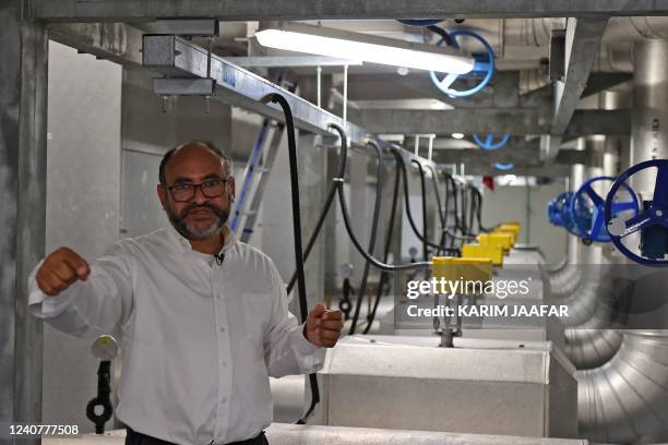 Saud Abdulaziz Abdul Ghani gives a tour of the cooling system at the al-Janoub Stadium on April 20, 2022 in Doha, which will host matches of the FIFA...