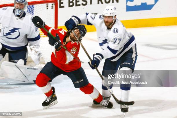 Ryan Lomberg of the Florida Panthers gets his in the face by the stick of Ryan McDonagh of the Tampa Bay Lightning during third period action in Game...