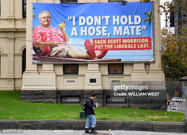 Billboard showing Australia's Prime Minister Scott Morrison adorns the side of the Trades Hall building in Melbourne on May 20 a day before Australia...