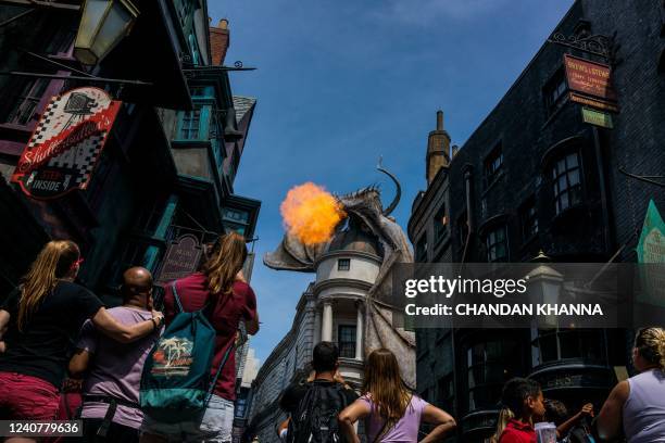 Tourists visit Harry Potter and the Escape from Gringotts- Diagon Alley themed area at Universal Studios Florida in Orlando, Florida on May 19, 2022....