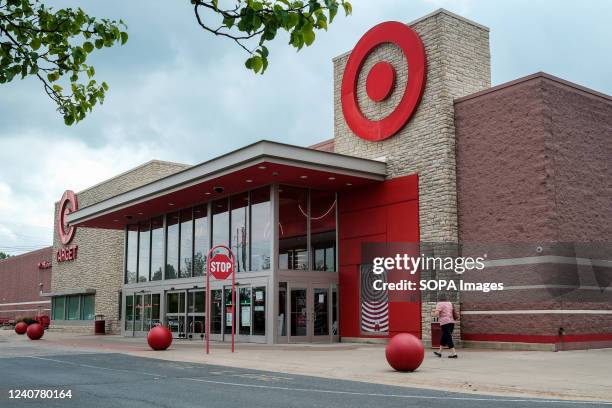 Woman walks in front of a Target store at Monroe Marketplace. Target reported a 52% drop in profit for the first quarter of 2022. The company blamed...