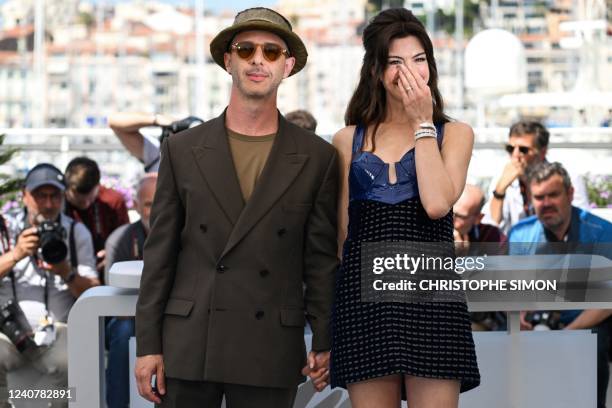 Actor Jeremy Strong and US actress Anne Hathaway pose during a photocall for the film "Armageddon Time" at the 75th edition of the Cannes Film...