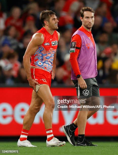 Josh P. Kennedy of the Swans leaves the field injured during the 2022 AFL Round 10 match between the Carlton Blues and the Sydney Swans at Marvel...