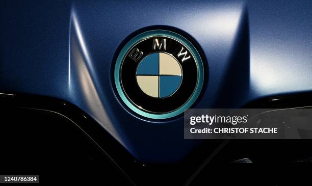 The BMW logo is seen on the bonnet of a new BMW i4 car during an event marking the 100th anniversary of the BMW plant in Munich, southern Germany, on...