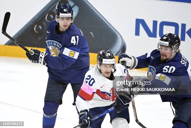Finland's defender Miro Heiskanen and Finland's defender Mikael Seppala play against Great Britain's forward Jonathan Phillips during the IIHF Ice...