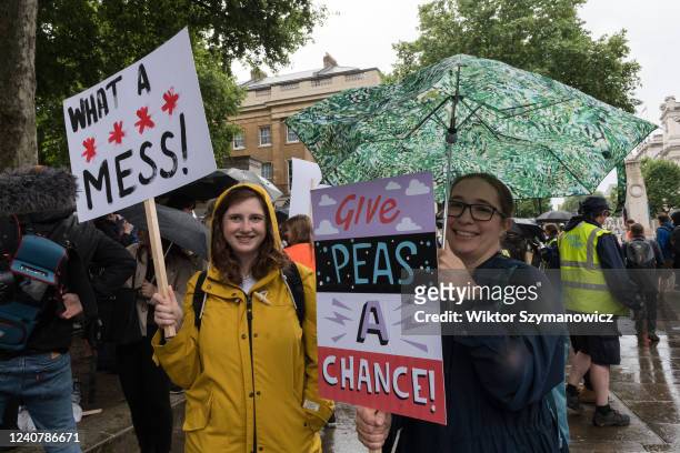 Members of the public gather outside Downing Street in a protest against the government's U-turn on its anti-obesity strategy on May 20, 2022 in...