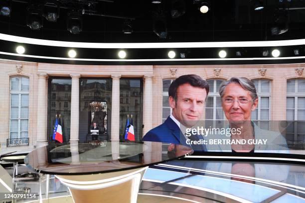 General view shows the studio set with the images of France's Prime Minister Elisabeth Borne and French President Emmanuel Macron prior to Borne...