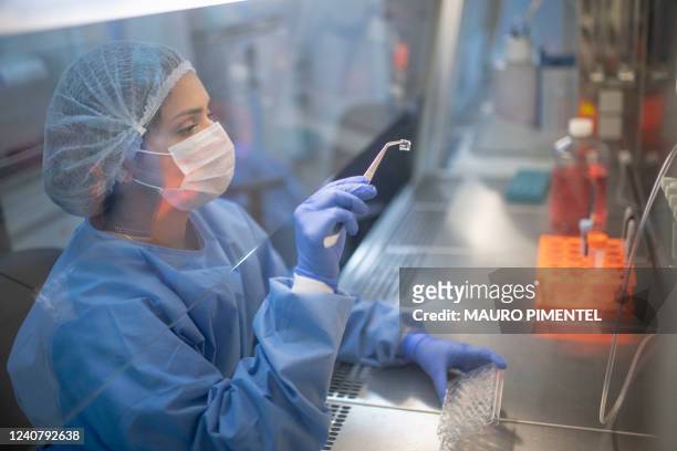 Researchers works in a laboratory dedicated to grow cells to produce reconstructed human tissue at the Episkin laboratory, inside the L'oreal Center...