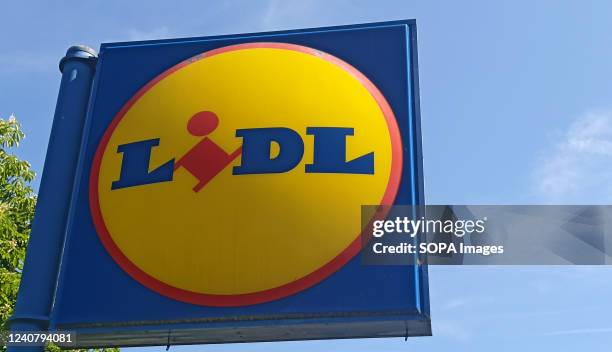 Lidl supermarket sign on blue sky background.