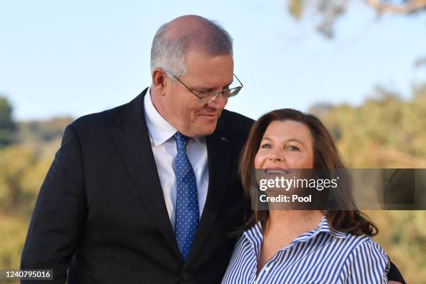 Prime Minister Scott Morrison and his wife Jenny pose for photographers on Federal Election day, in the seat of McEwen on May 21, 2022 in Melbourne,...