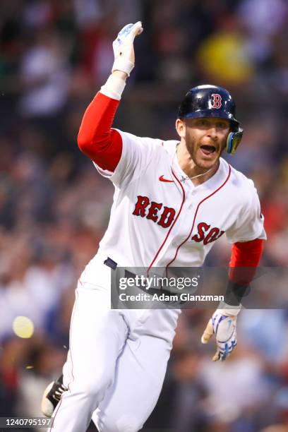 Trevor Story of the Boston Red Sox hits a grand slam in the third inning of a game against the Seattle Mariners at Fenway Park on May 20, 2022 in...