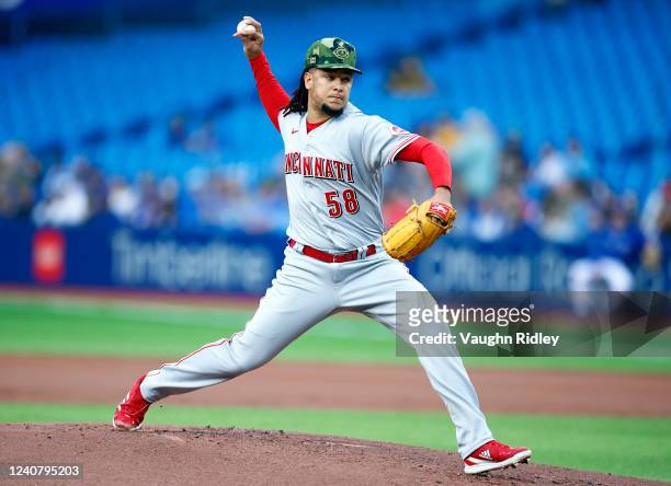 Luis Castillo of the Cincinnati Reds delivers a pitch in the first inning during a MLB game against the Toronto Blue Jays at Rogers Centre on May 20,...