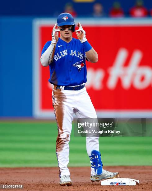 Matt Chapman of the Toronto Blue Jays celebrates after hitting a double in the second inning during a MLB game against the Cincinnati Reds at Rogers...