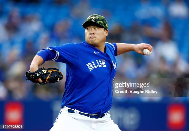 Hyun Jin Ryu of the Toronto Blue Jays delivers a pitch in the third inning during a MLB game against the Cincinnati Reds at Rogers Centre on May 20,...