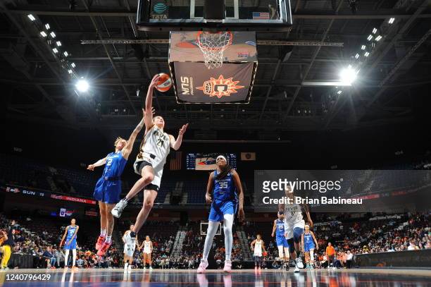 Emily Engstler of the Indiana Fever drives to the basket during the game against the Connecticut Sun on May 20, 2022 at the Mohegan Sun Arena in...
