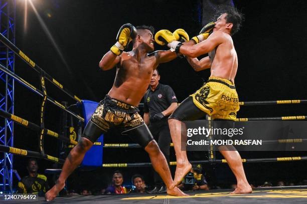 This photo taken on May 20, 2022 Muay Thai boxers competing during a competition in Kota Bharu, Malaysia's Kelantan state.