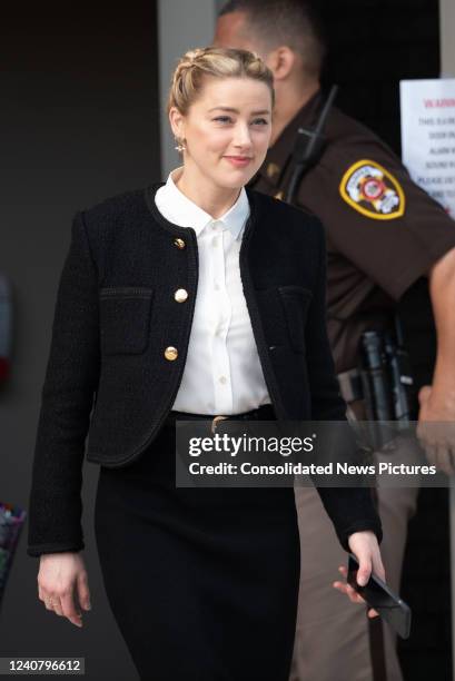 Amber Heard departs outside court during the Johnny Depp and Amber Heard civil trial at Fairfax County Circuit Court on May 19, 2022 in Fairfax,...