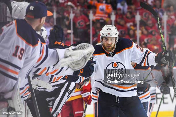 Leon Draisaitl of the Edmonton Oilers celebrates with the bench after scoring against the Calgary Flames during the third period of Game Two of the...