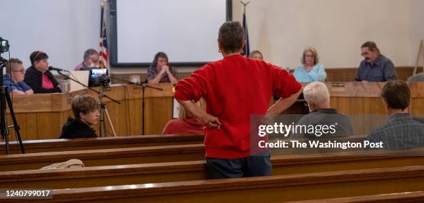 Town resident stands up during the April 19, 2022 Town Council meeting. The town of Pound, Virginia is struggling with the same economic problems...