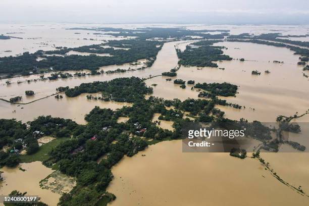 This aerial photograph shows houses inundated following heavy rains in Beanibazar on May 21, 2022.
