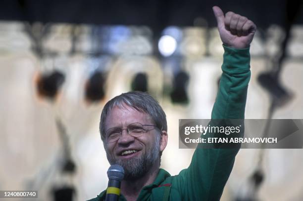 Colombian presidential candidate for the Green Party, Antanas Mockus, gives the thumb up as he delivers a speech during a rally in Bogota on May 16,...