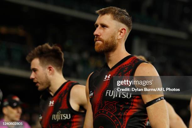 Dyson Heppell of the Bombers looks dejected after a loss during the 2022 AFL Round 10 match between the Richmond Tigers and the Essendon Bombers at...