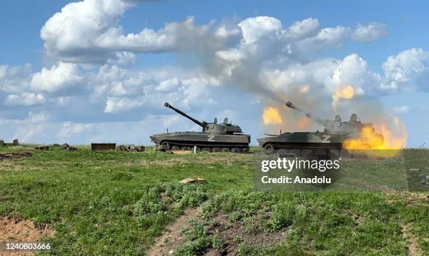 Military vehicles of the DPR army prepare to fire artillery shell with leaflets in the direction of Ukrainian positions with a proposal to surrender,...