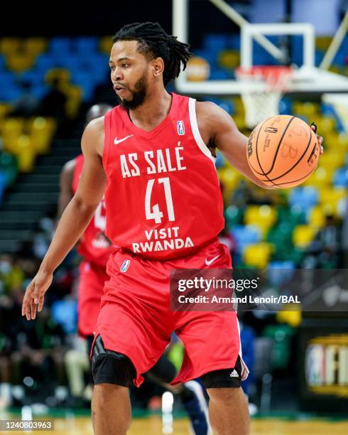 Terrel De Von of the AS Salé dribbles the ball during the game against the Clube Atlético Petroleos de Luanda on May 21, 2022 at the Hassan Mostafa...