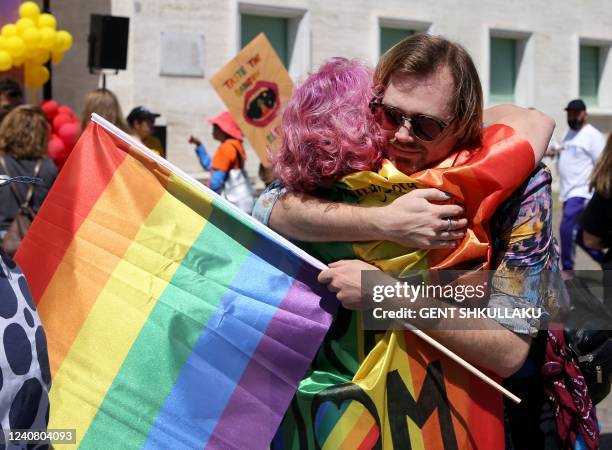 Albanian LGBT activists embrace as they attend Tirana Gay Pride to mark the International Day Against Homophobia, Transphobia and Biphobia in Tirana...