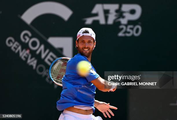 Portugals Joao Sousa plays a forehand return to Norways Casper Ruud during their singles final match at the ATP 250 Geneva Open tennis tournament in...