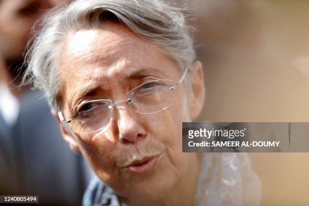 France's Prime Minister and parliamentary candidate Elisabeth Borne addresses media representatives in Villers-Bocage, northern France on May 21...