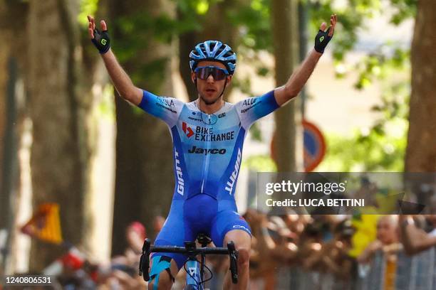 Team BikeExchange Jayco Mitchelton's British rider Simon Yates celebrates as he crosses the finish line to win the 14th stage of the Giro 'Italia...