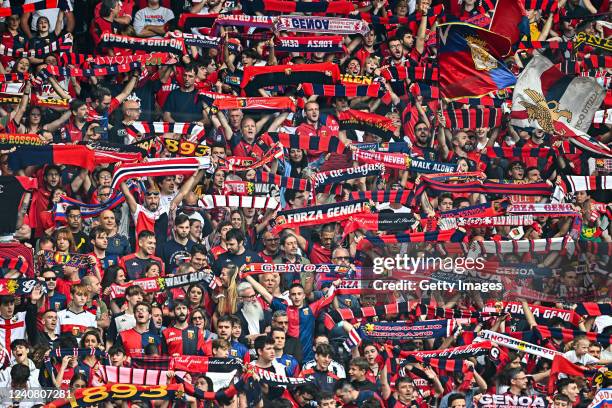 Fans of Genoa wave their flags and scarves prior to kick-off in the Serie A match between Genoa CFC and Bologna Fc at Stadio Luigi Ferraris on May...