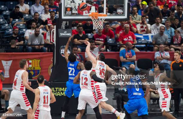 Cory Higgins of FC Barcelona competes against Kostas Papanikolaou of Olympiacos Piraeus under the basket during the 2022 Turkish Airlines EuroLeague...