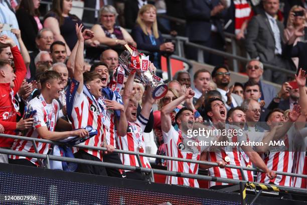 Sunderland celebrate winning promotion as Corry Evans of Sunderland lifts the trophy with his team mates during the Sky Bet League One Play-Off Final...