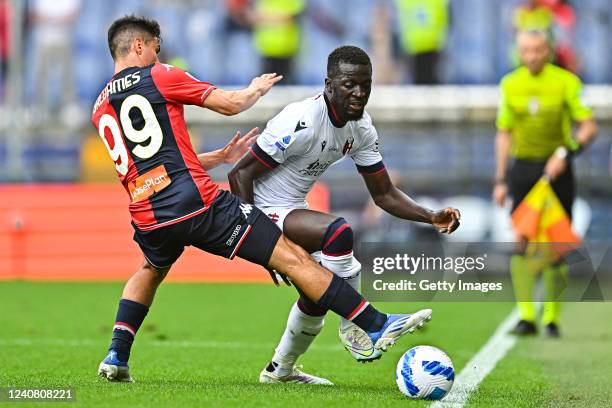 Pablo Galdames of Genoa and Musa Barrow of Bologna vie for the ball during the Serie A match between Genoa CFC and Bologna Fc at Stadio Luigi...