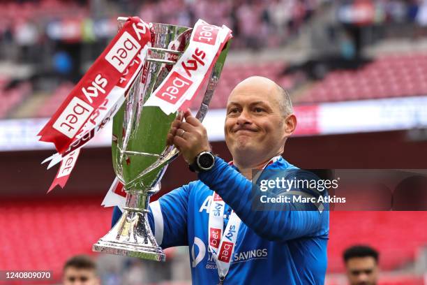 Alex Neil manager of Sunderland celebrates with the trophy after securing promotion to the Championship during the Sky Bet League One Play-Off Final...