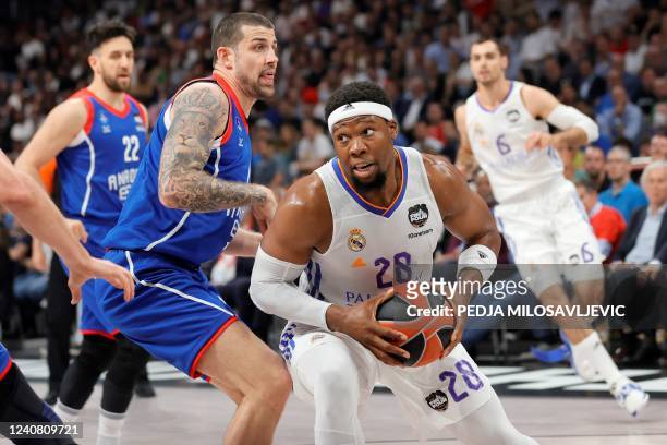 Real Madrid's Guerschon Yabusele vies with Anadolu Efes' Adrien Moerman during the EuroLeague Final Four final basketball match between Real Madrid...