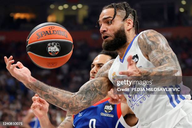 Real Madrid's Jeffery Taylor fights for the ball with Anadolu Efes' Shane Larkin during the EuroLeague Final Four final match between Real Madrid and...