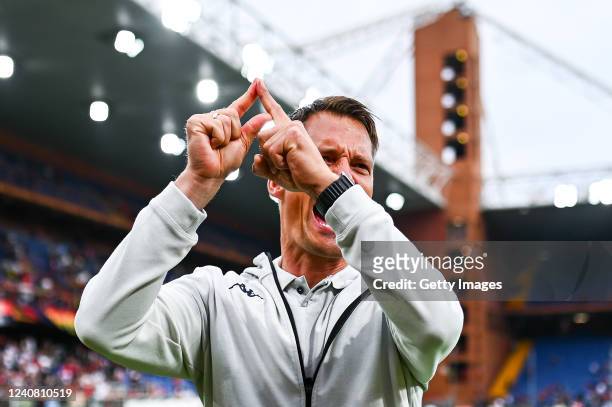 Alexander Blessin head coach of Genoa shows the letter A with his fingers as he greets the crowd after the Serie A match between Genoa CFC and...