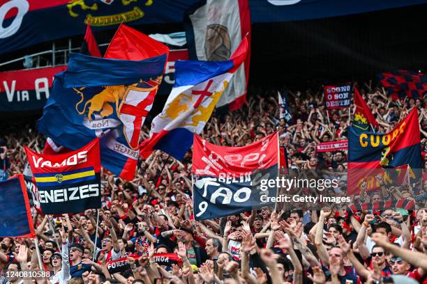 Fans of Genoa wave their flags and scarves after the Serie A match between Genoa CFC and Bologna Fc at Stadio Luigi Ferraris on May 21, 2022 in...